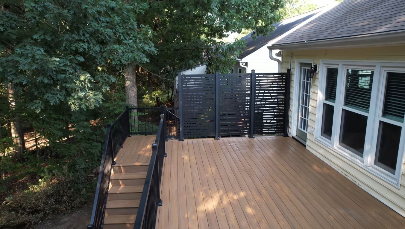 Multi-zone deck with dining area and privacy screens